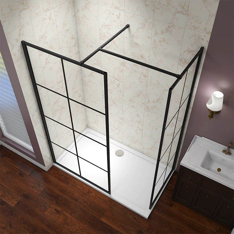 Bathroom with a black-framed shower enclosure and sink.