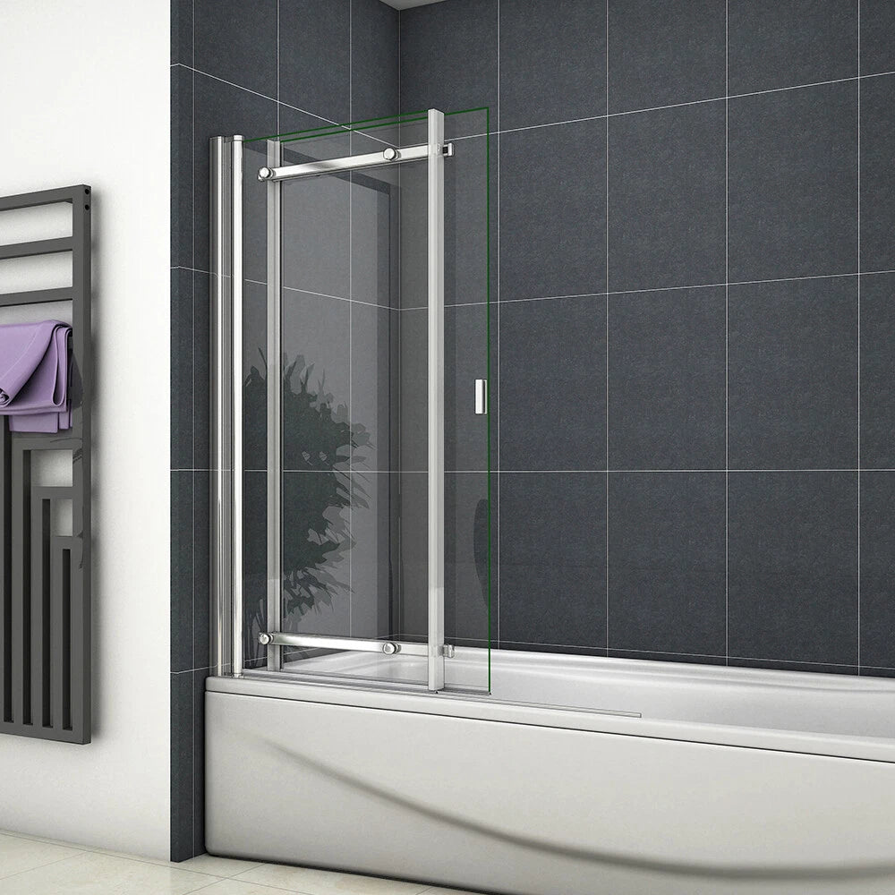 Chrome pivot sliding bath shower screen 900x1400mm installed on white bath with clear glass panels and grey tiled bathroom wall