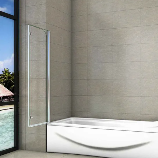 Bathroom with a white bathtub and glass shower door against a modern tiled wall.