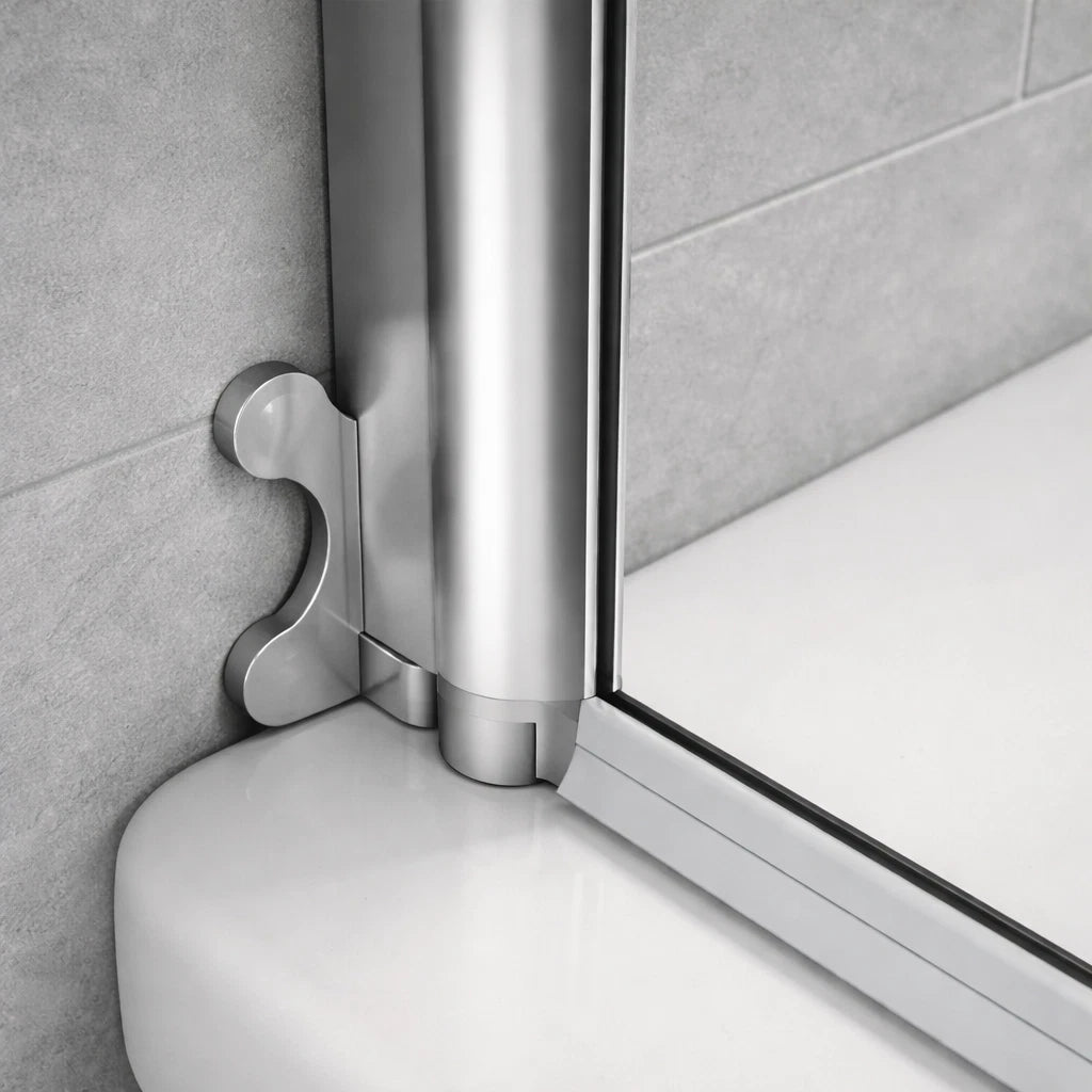 Close-up of chrome pivot bath shower screen bottom hinge and seal resting on a white bathtub edge showing wall fixing and glass alignment