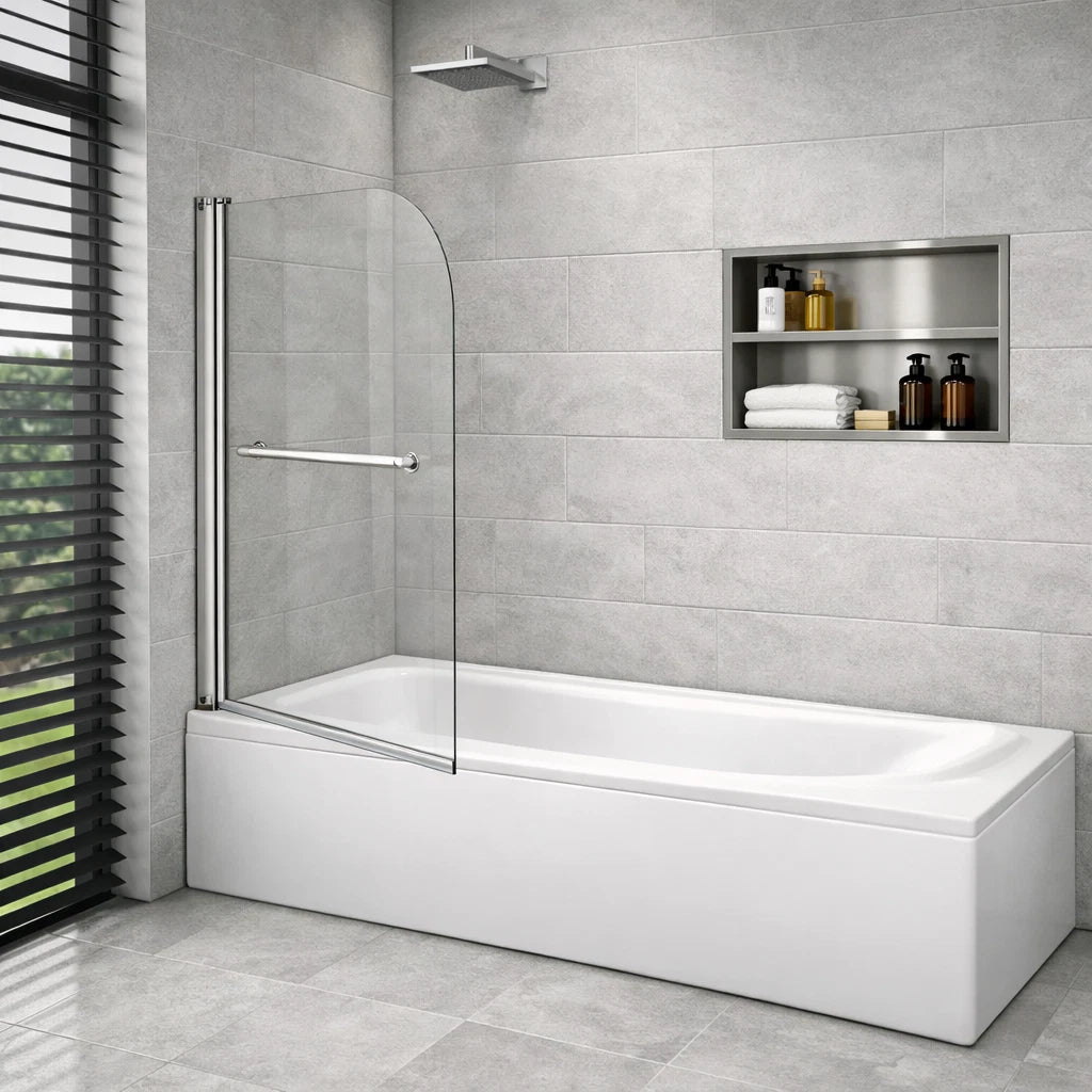 Chrome pivot bath shower screen with curved glass panel fitted to a straight white bathtub in a modern grey tiled bathroom with recessed wall shelf