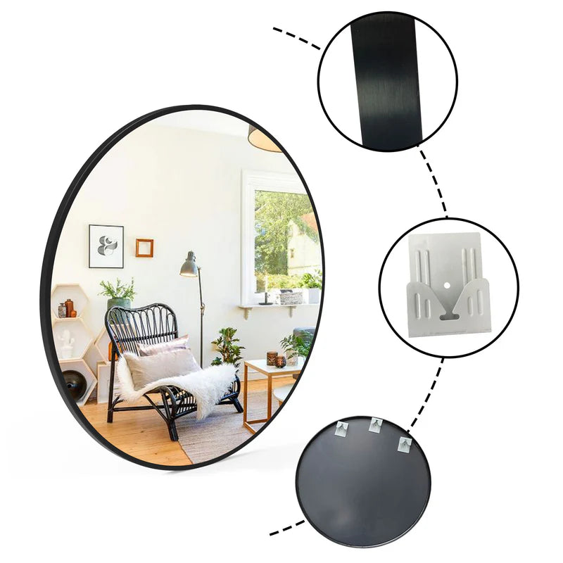 Round mirror with black frame and wall mountings on a white background