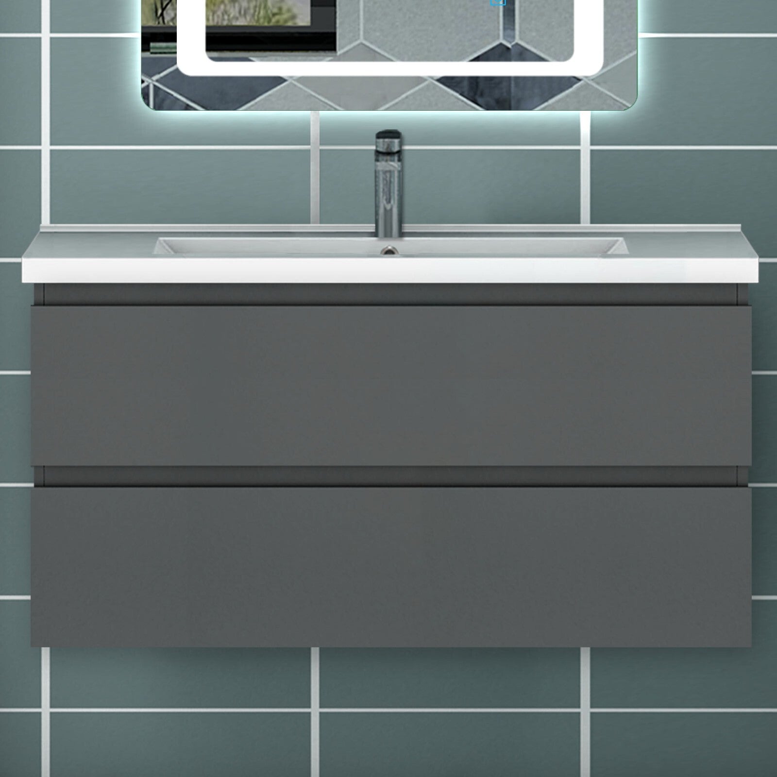 Grey wall hung vanity unit with integrated basin front view under LED mirror in tiled bathroom