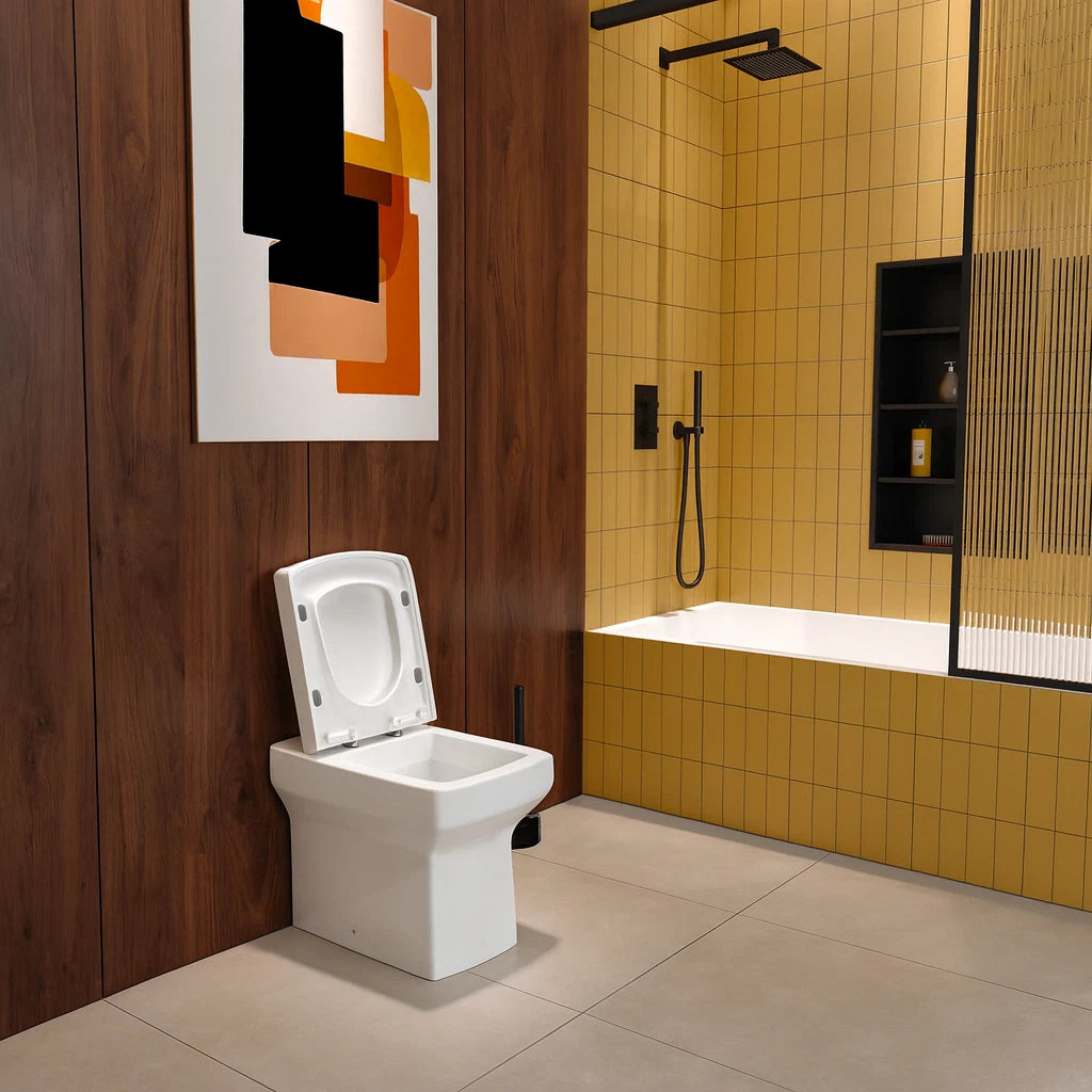 Modern bathroom with white toilet, yellow tiled walls, and abstract art on the wall.