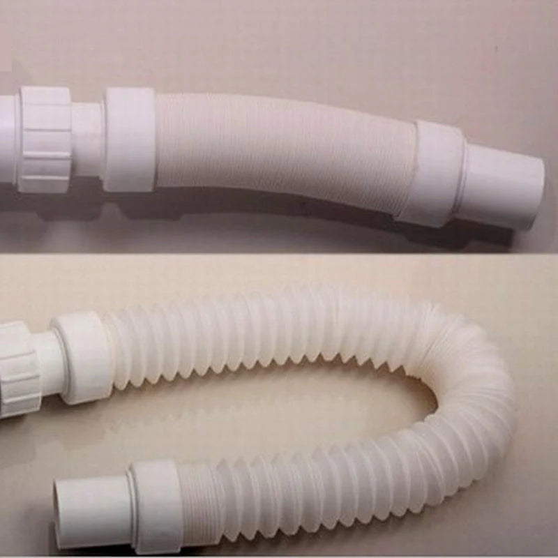 White plastic hose with connectors on a beige background