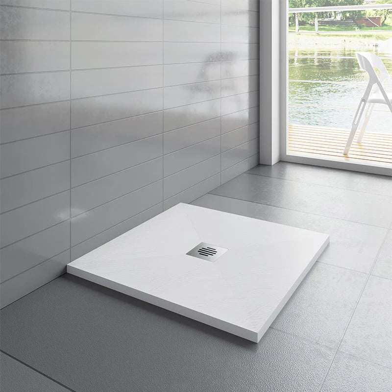 Square shower base with drain in a modern bathroom setting