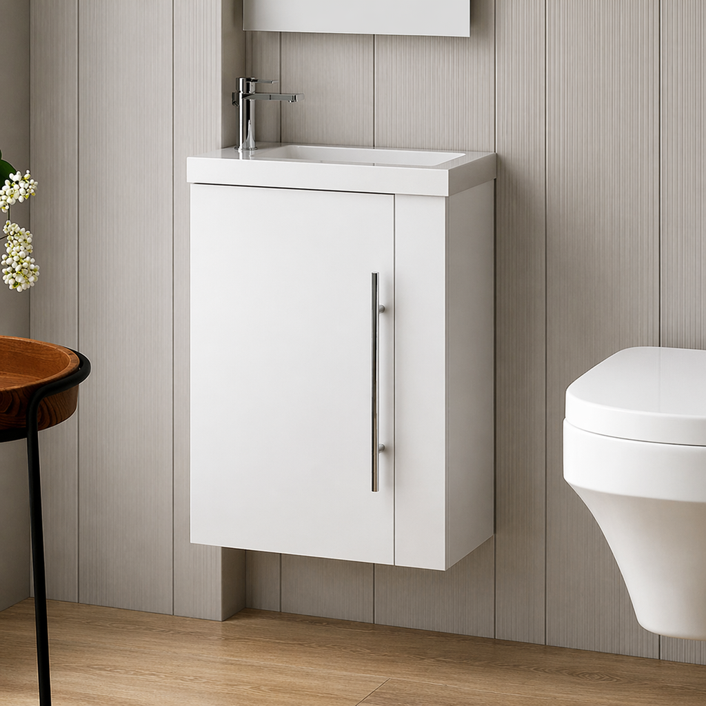 Bathroom with white vanity unit, sink, and toilet against a wooden floor and wall.