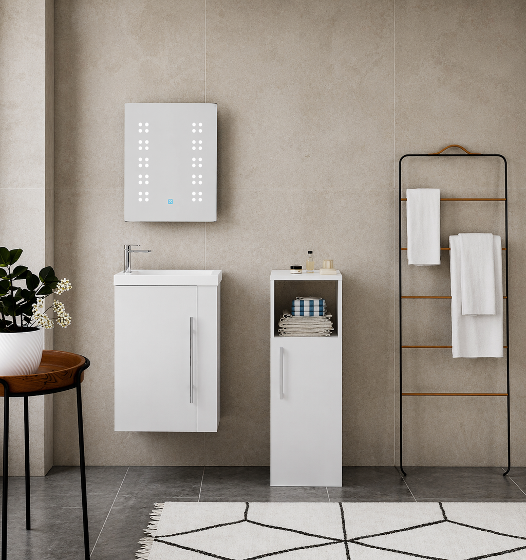 Bathroom setup with white vanity unit, mirror, and towel rack against a tiled wall.