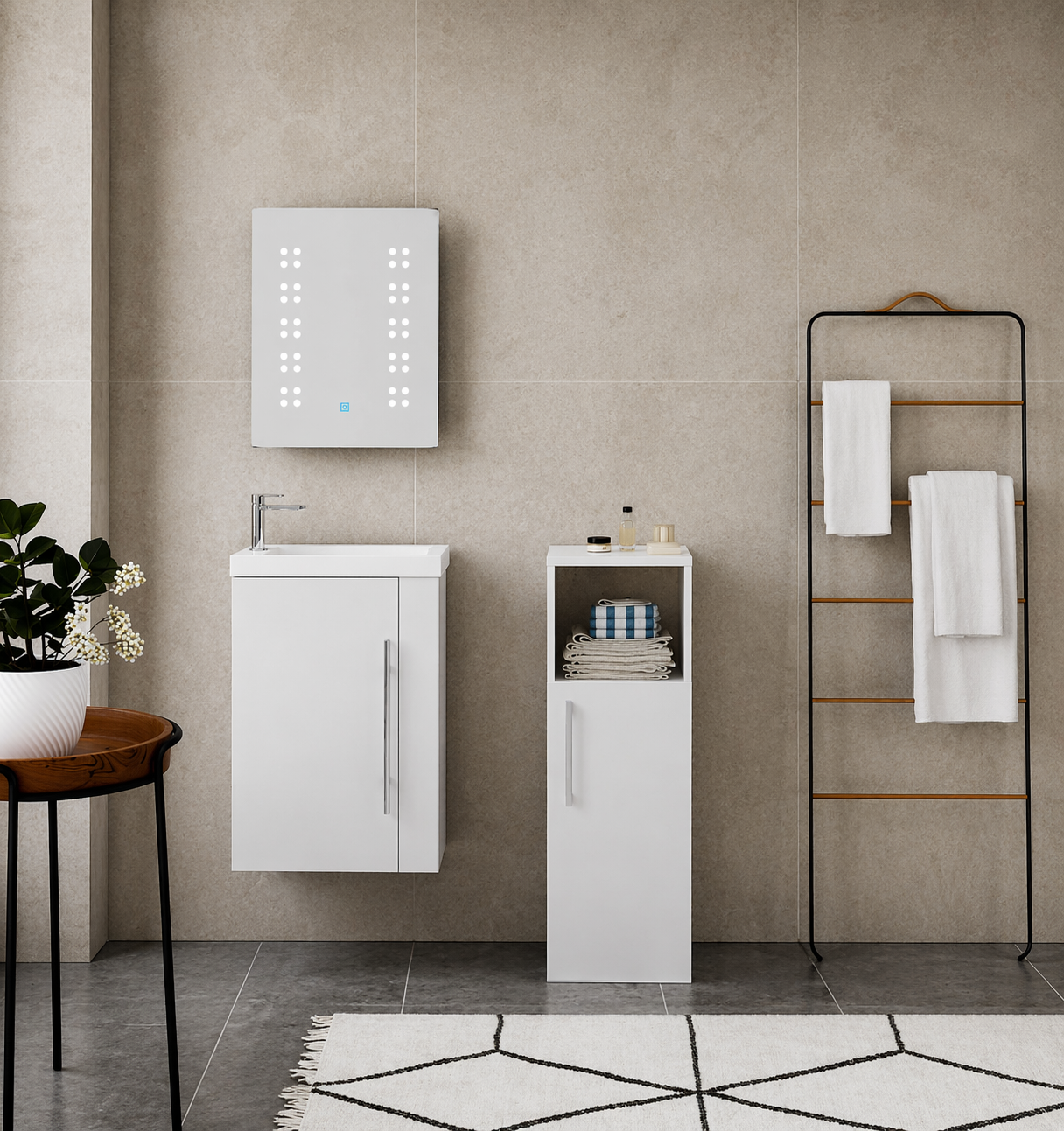 Bathroom setup with white vanity unit, mirror, and towel rack against a tiled wall.
