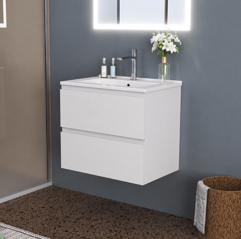 White wall hung vanity unit in modern bathroom with LED mirror and chrome tap