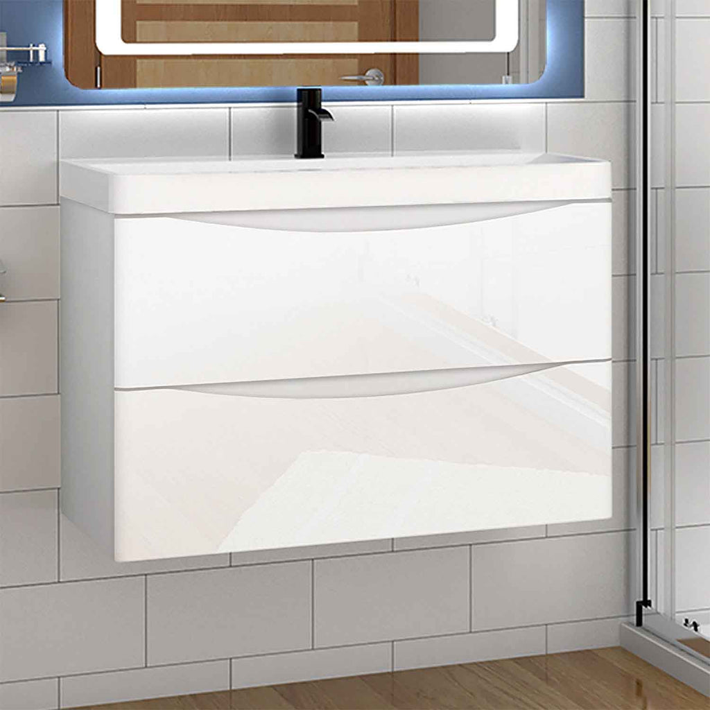 Bathroom vanity with white cabinet, black faucet, and illuminated mirror.