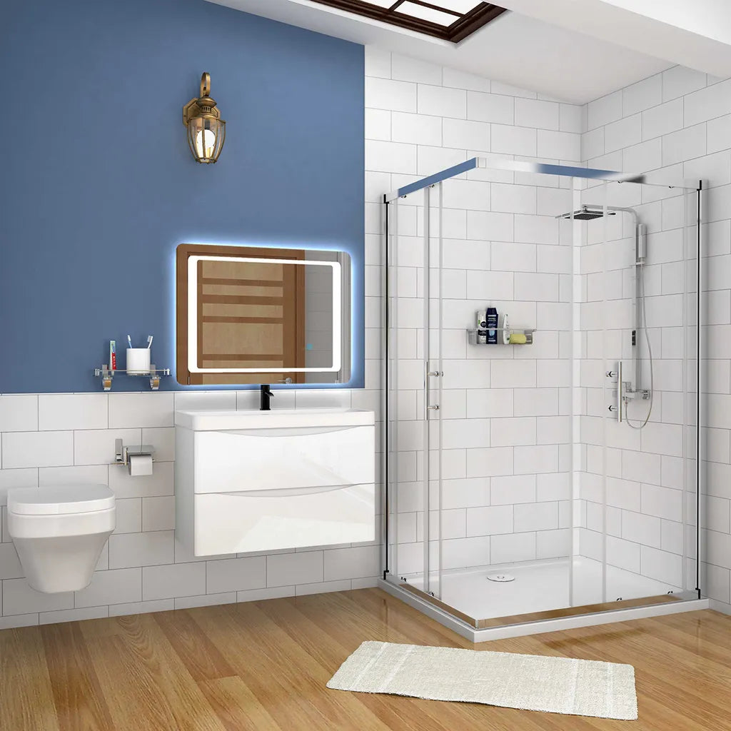 Modern bathroom with shower, sink, and toilet against a blue wall.