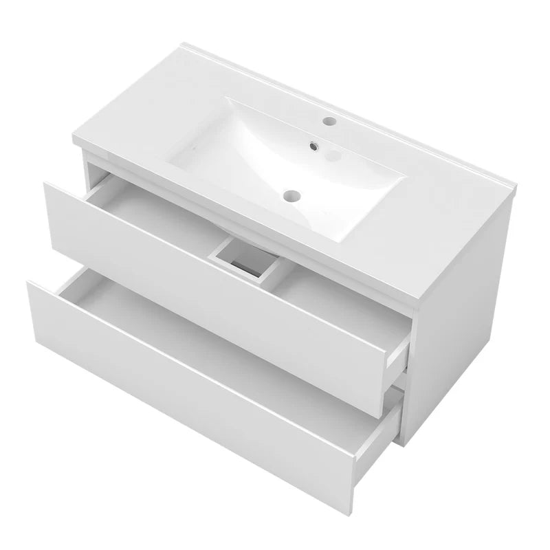 White wall hung vanity unit top view with open drawers showing internal storage compartments