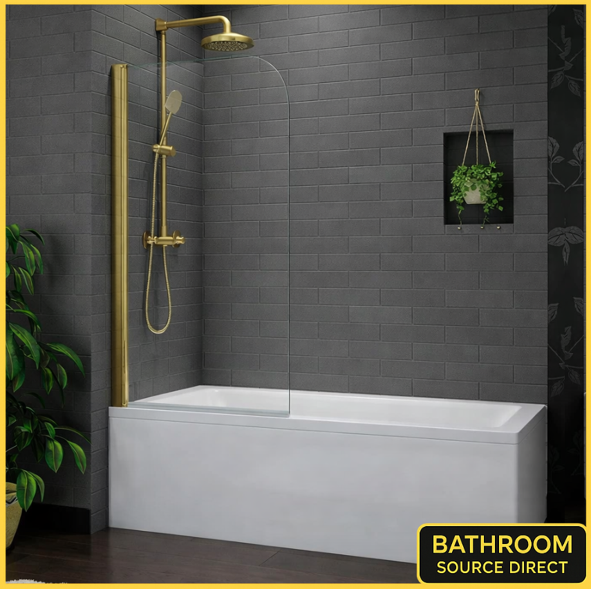 Bath Shower Screen With Brushed Gold Frame And Clear Glass Installed Over Bath In Modern Dark Grey Tiled Bathroom With Gold Shower