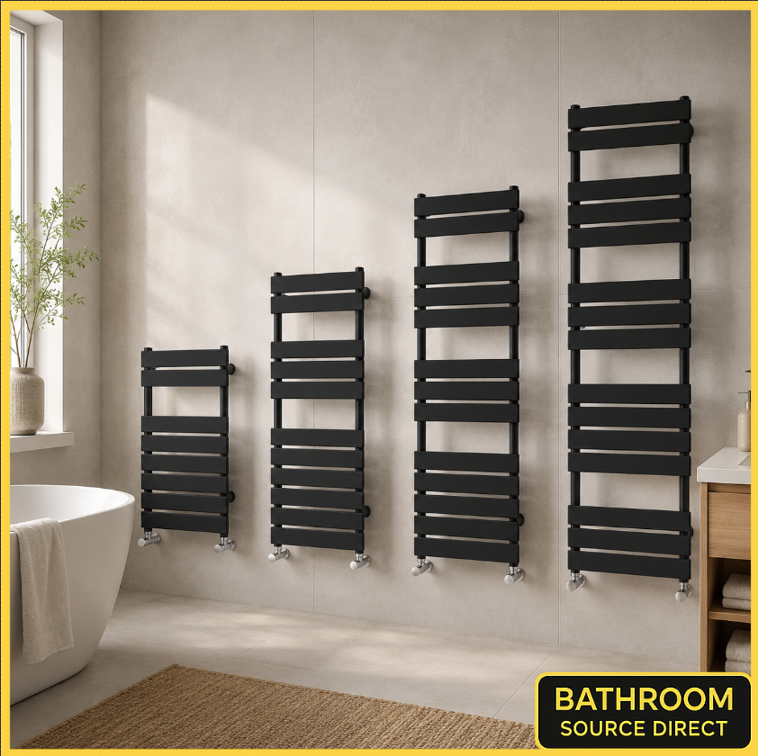 Set of black flat panel heated towel rail radiators in modern bathroom setting available in multiple heights from Bathroom Source Direct.