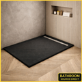 Black slate effect stone resin shower tray 1700mm with linear waste in modern bathroom setting