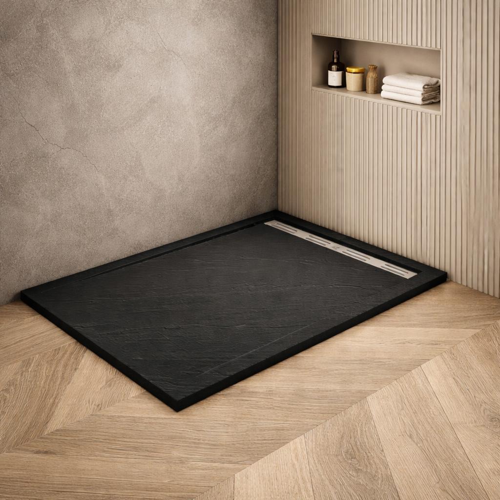 Black slate effect shower tray in modern bathroom with textured wall finish