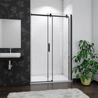 Modern bathroom with a shower enclosure, plant, and decorative wall.