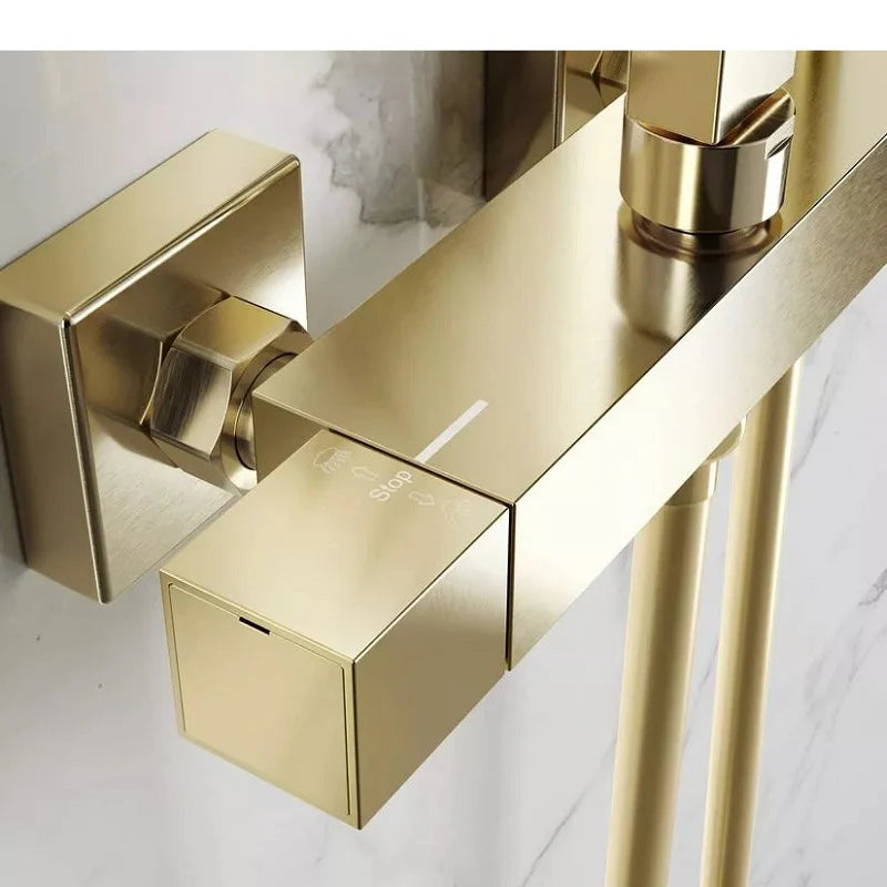Thermostatic bar valve in brushed brass shower system detail