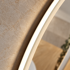 Side profile of the K-LIGHT Burleigh mirror showing its illuminated white acrylic edge against stone-effect tiles
