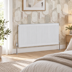 K Rad Type 21 white central heating radiator, 600mm x 1300mm, wall mounted in a modern bedroom with beige geometric wallpaper and oak flooring