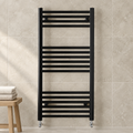 K-Warm black ladder towel rail in a modern bathroom setting