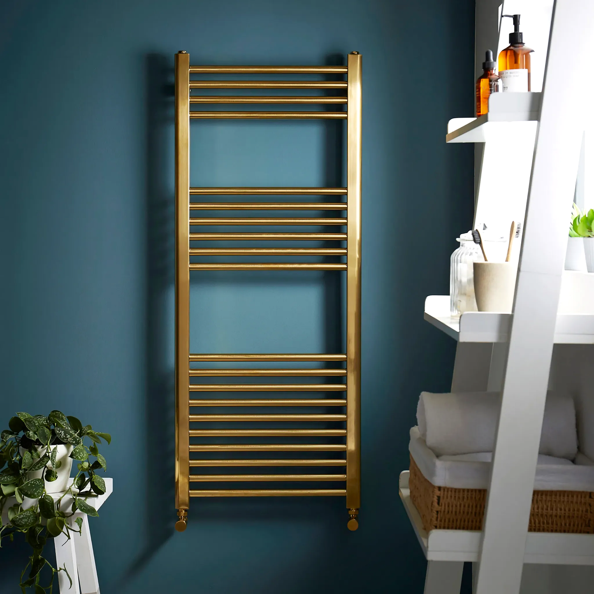 K Warm 500 x 1600mm brushed brass towel rail in a modern bathroom