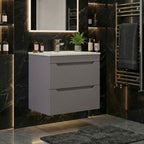 Keldon Slate Grey two drawer wall hung vanity unit in a dark tiled bathroom