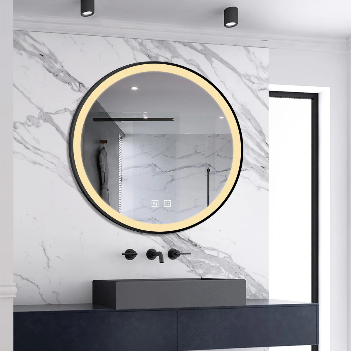 Black-framed round LED bathroom mirror illuminated in warm white above a basin
