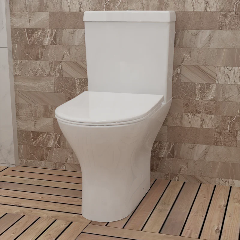 Modern close coupled toilet 600mm short projection soft close seat in grey tiled bathroom with LED lighting