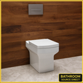 White toilet against a wooden wall with 'Bathroom Source Direct' branding.