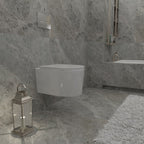 Oakham wall hung toilet installed in a modern grey tiled bathroom