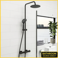 Orin round thermostatic shower riser kit in matt black with rainfall head in modern bathroom