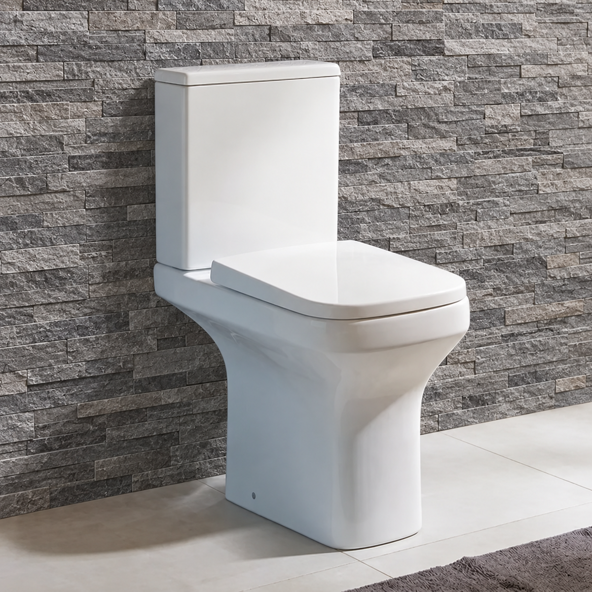 Ozone comfort height close coupled toilet with square rimless pan and soft close seat