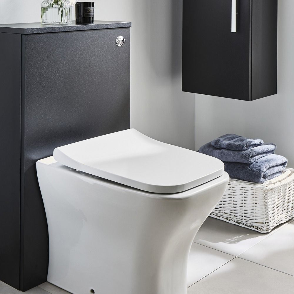 Purity matt black WC unit installed with a back to wall toilet