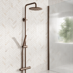 Scudo Core brushed bronze rigid riser shower beside a fluted wetroom screen