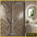 Scudo Core chrome thermostatic rigid riser shower with espresso herringbone tiles