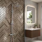 Scudo Core chrome rigid riser shower installed beside a wall hung vanity