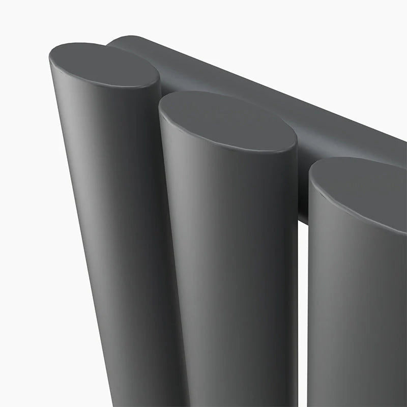 Close-up of three gray cylindrical objects on a white background