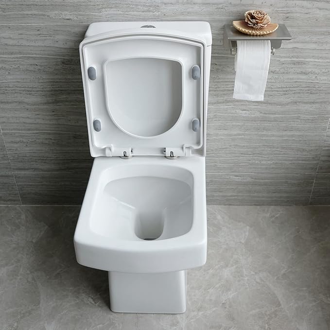 Front view of square close coupled toilet with soft close seat in modern bathroom setting
