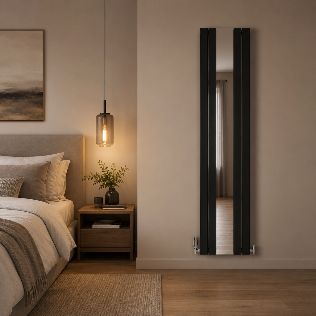 Thermwell black mirrored vertical radiator installed in a modern bedroom