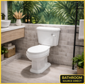 Traditional Victorian close coupled toilet with soft close seat in ensuite with green jungle wallpaper and tiled walls