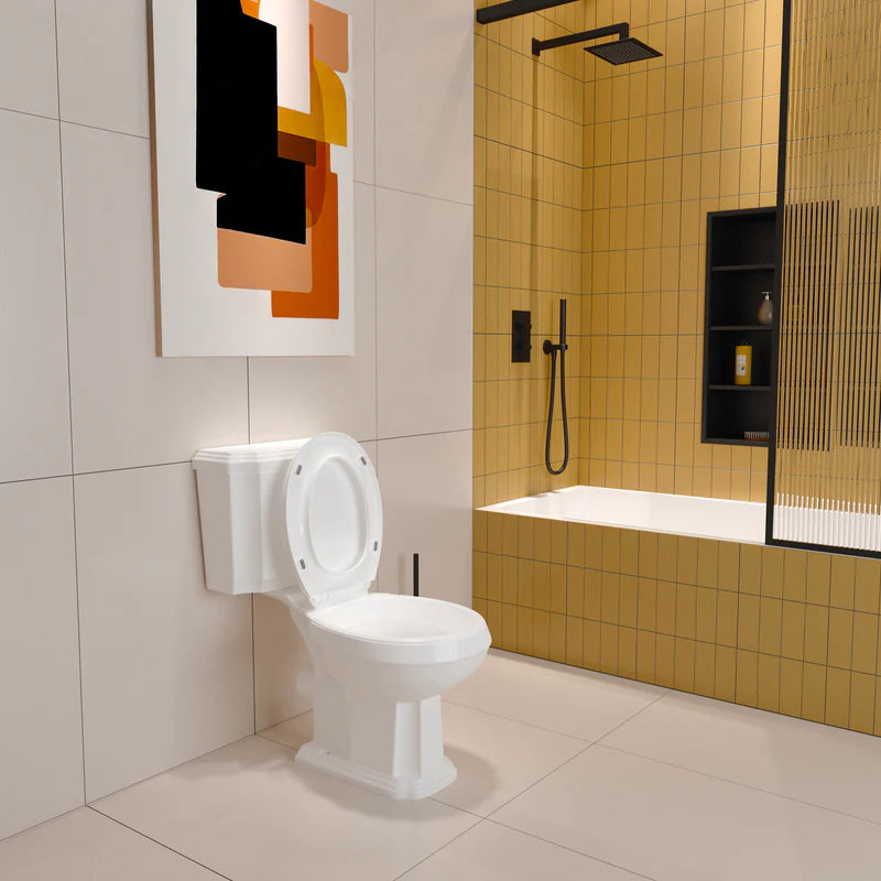 Traditional Victorian close coupled toilet installed in bathroom with tiled wall and wooden floor