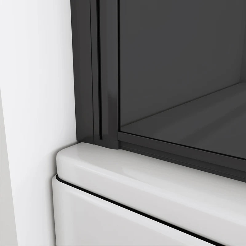 Close-up of bath shower screen bottom seal and black aluminium glass profile