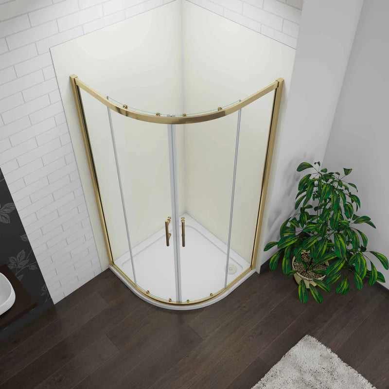 Corner shower enclosure with gold frame in a bathroom setting