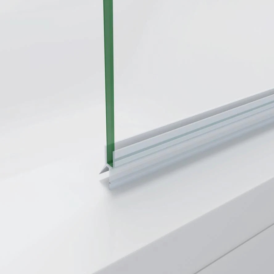 Close-up of bath shower screen bottom seal and water deflector on bathtub edge