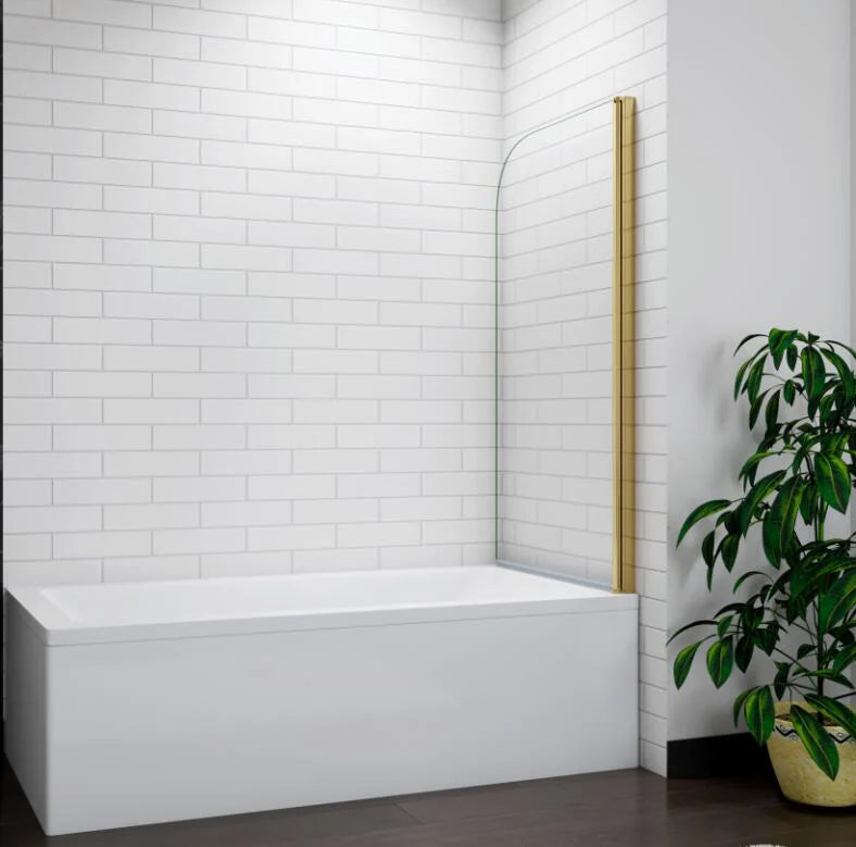 Brushed gold curved bath shower screen installed on bathtub in modern white tiled bathroom