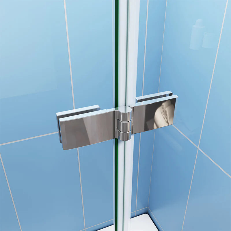 Close-up of chrome bath shower screen hinge connection between folding glass panels
