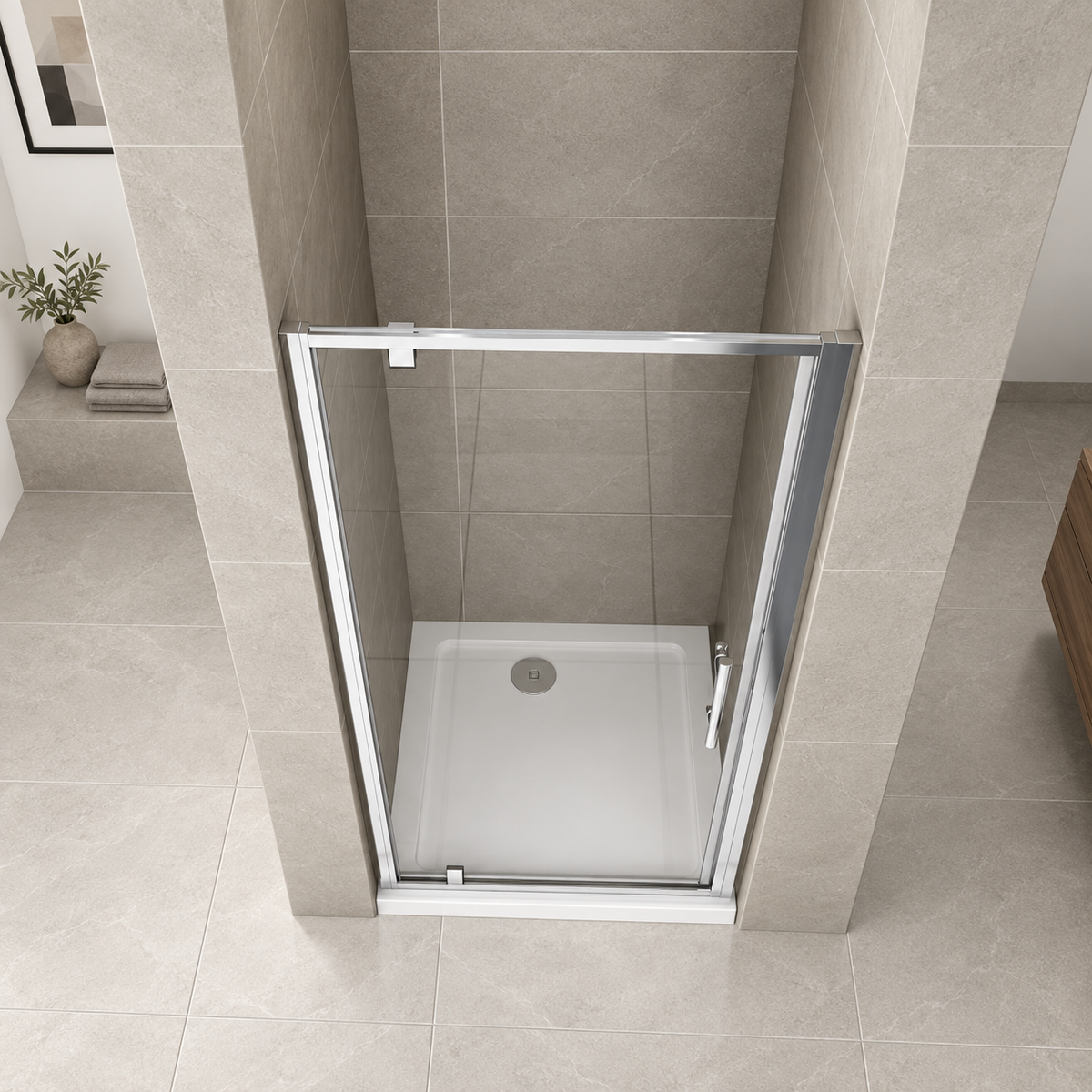 Overhead view of the Vitrano chrome pivot shower door showing the shower tray and recessed installation