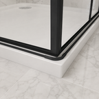 Close up of the matt black bottom rail and water bar on the Vitrano double bi fold shower enclosure